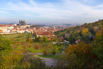Fototapeta na wymiar Autumn Prague City with gothic Castle and colorful Nature and Trees from the Hill Petrin, Czech Republic