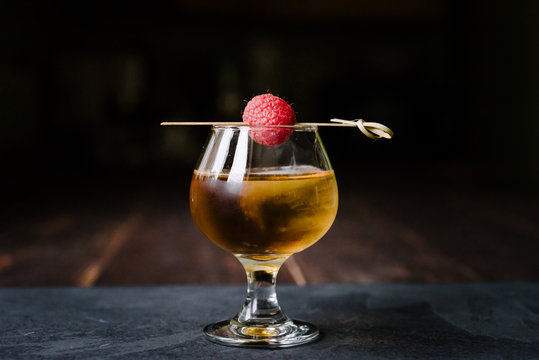 Cognac Glass with a Raspberry