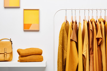 Bright yellow clothing in wardrobe room