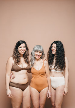 Mixed races and ages women laughing.