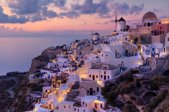 Aerial view of Santorini (Thira), Oia, Greece, during scenic sunset.
