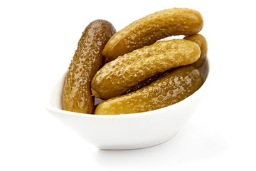 Marinated pickled cucumbers, gherkin, salted cornichon, isolated on white background