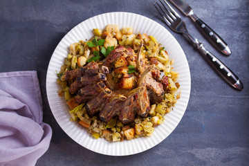 Crown roast of pork with apple and bread stuffing. View from above, top view