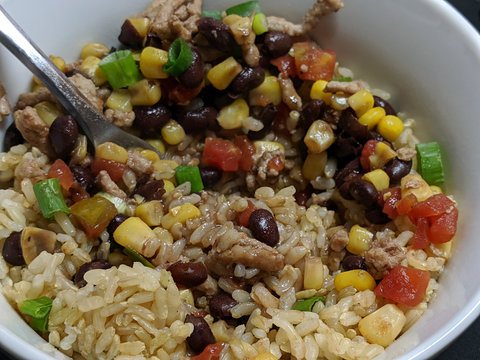 Ground Turkey, Corn, And Black Beans Over Rice In White Bowl