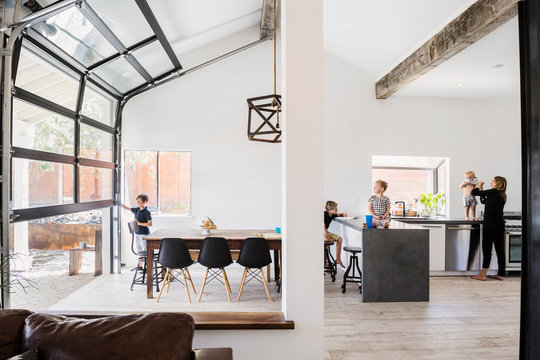 Mother and children in kitchen and dining room