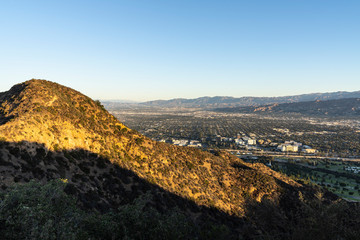 Fototapeta na wymiar Morning cityscape view of Burbank and the sprawling San Fernando Valley. Shot from mountaintop near popular Griffith Park in Southern California.