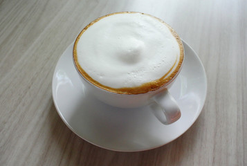 Morning cup, Hot latte coffee on wooden table