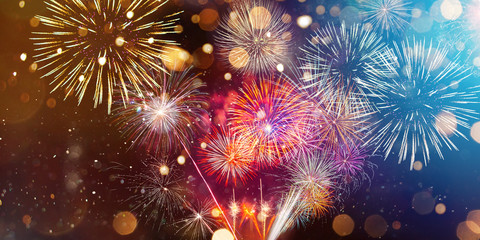 Colorful firework with bokeh background. New Year celebration, Abstract holiday background - Powered by Adobe