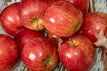 Fototapeta na wymiar Ripe red apples closeup. Autumn harvest concept.