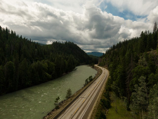 Aerial Panoramic View of a Scenic Highway in the Valley surrounded by Canadian Mountain Landscape. Taken near Clearwater, North of Kamloops, British Columbia, Canada.