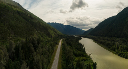 Aerial Panoramic View of a Scenic Highway in the Valley surrounded by Canadian Mountain Landscape. Taken near Clearwater, North of Kamloops, British Columbia, Canada.
