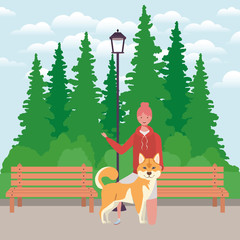 young woman with cute dog mascot in the park