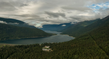 Aerial Panoramic View of Kootenay River during a cloudy summer sunrise. Taken near Nelson, British Columbia, Canada.