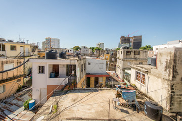 Santo Domingo, Dominican Republic; April 11, 2014: View of The Roofs of Some Poor Houses, There is Much Chaos by the Wires of Electric Poles