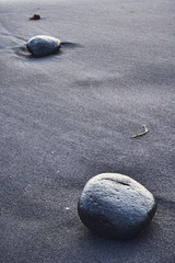 Black stone and sand