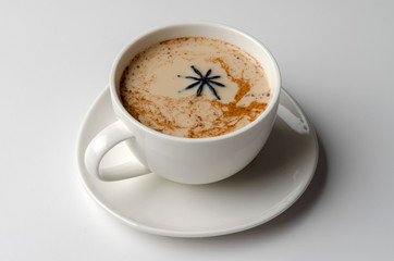 Indian Traditional Masala Chai in Cup. Spiced Tea With Milk on White Background