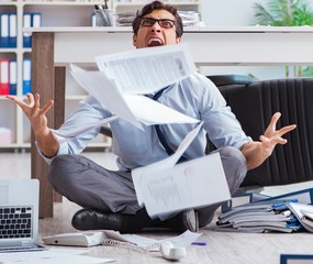 Bankrupt businessman angry in the office floor