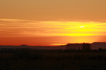 Beatiful sunset  in the mountains next to cornfields
