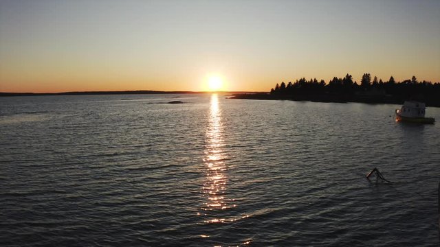 Aerial view on boats on the ocean during the sunset time in Blue rocks nova scotia