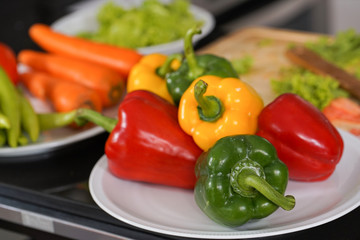 colored sweet peppers on desk in ketchen