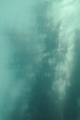 Grunge background in shades of teal blue