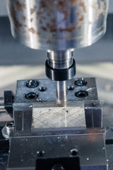 Fototapeta na wymiar Metalworking CNC milling machine. Cutting aluminium parts in modern processing technology.