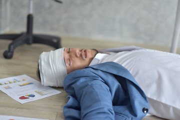 A dedicated company staff works hard even when they get sick and fall ill. Business concept