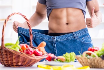 The young man in healthy eating and dieting concept