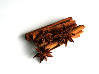 Cinnamon herbs and star anise, isolated on a white background