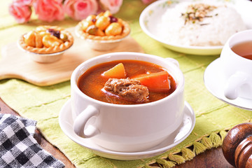 Braised beef with rice on the table
