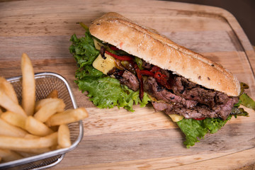 Arrachera chapata sandwich with french fries - mexican food 