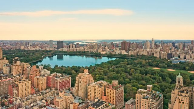 Aerial drone footage of New York Central Park and Upper West Side neighborhood at sunset.