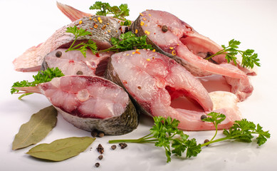 Fish steak with spices on white background