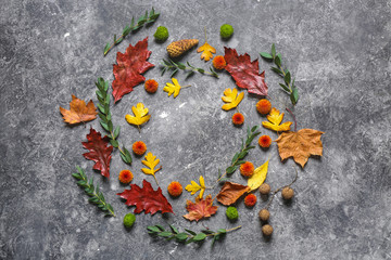 Composition with autumn flowers and leaves on grunge background