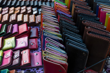 Colorful  handmade leather purses for sale in the market