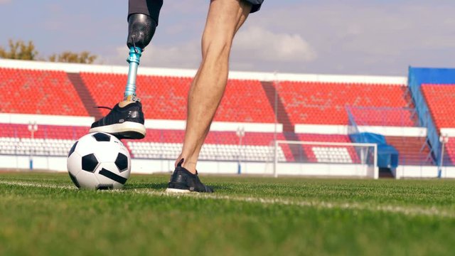 Football practice held by a disabled man at the stadium, soccer