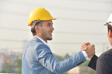 Business concept Engineers and technicians agree to work together to push.