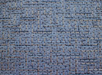 The texture of the fabric is blue with a relief. Background for design.