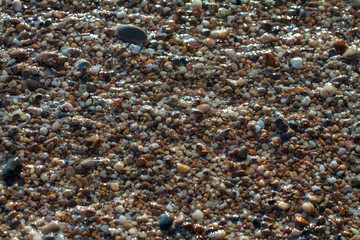 sea pebbles colored granite on the beach