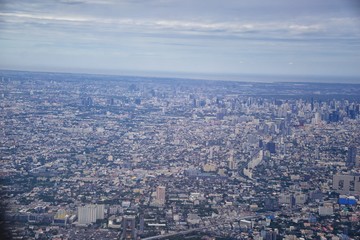 Naklejka premium Aerial view of Bangkok Thailand and surrounding landscape, modern office buildings, condominium, living place in Bangkok city downtown in the most populated. Southeast Asia.