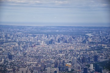 Aerial view of Bangkok Thailand and surrounding landscape, modern office buildings, condominium, living place in Bangkok city downtown in the most populated. Southeast Asia.