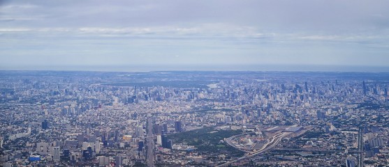 Aerial view of Bangkok Thailand and surrounding landscape, modern office buildings, condominium, living place in Bangkok city downtown in the most populated. Southeast Asia.