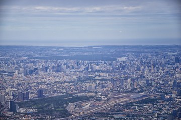 Aerial view of Bangkok Thailand and surrounding landscape, modern office buildings, condominium, living place in Bangkok city downtown in the most populated. Southeast Asia.