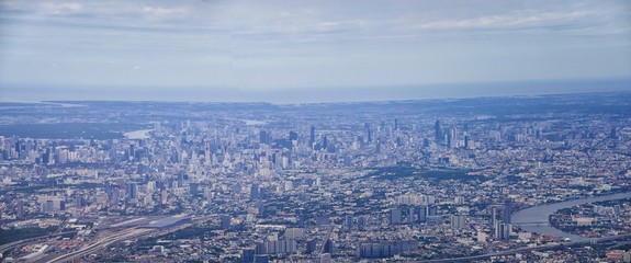 Aerial view of Bangkok Thailand and surrounding landscape, modern office buildings, condominium, living place in Bangkok city downtown in the most populated. Southeast Asia.