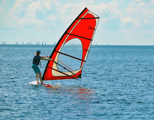 Young woman windsurfing on Biscayne Bay