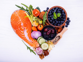 Heart shape of ketogenic low carbs diet concept. Ingredients for healthy foods selection on white...