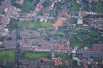 Aerial view of Bangkok Thailand and surrounding landscape, modern office buildings, condominium, living place in Bangkok city downtown in the most populated. Southeast Asia.