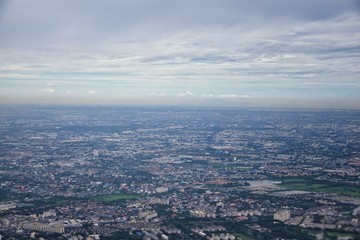 Aerial view of Bangkok Thailand and surrounding landscape, modern office buildings, condominium, living place in Bangkok city downtown in the most populated. Southeast Asia.