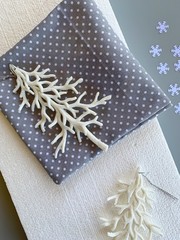 Christmas crafting materials on a gray table