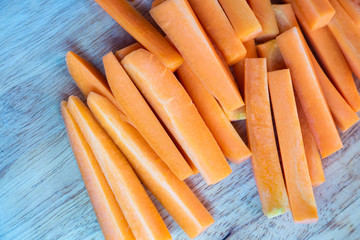 Closeup of fresh organic carrots sliced on the table.